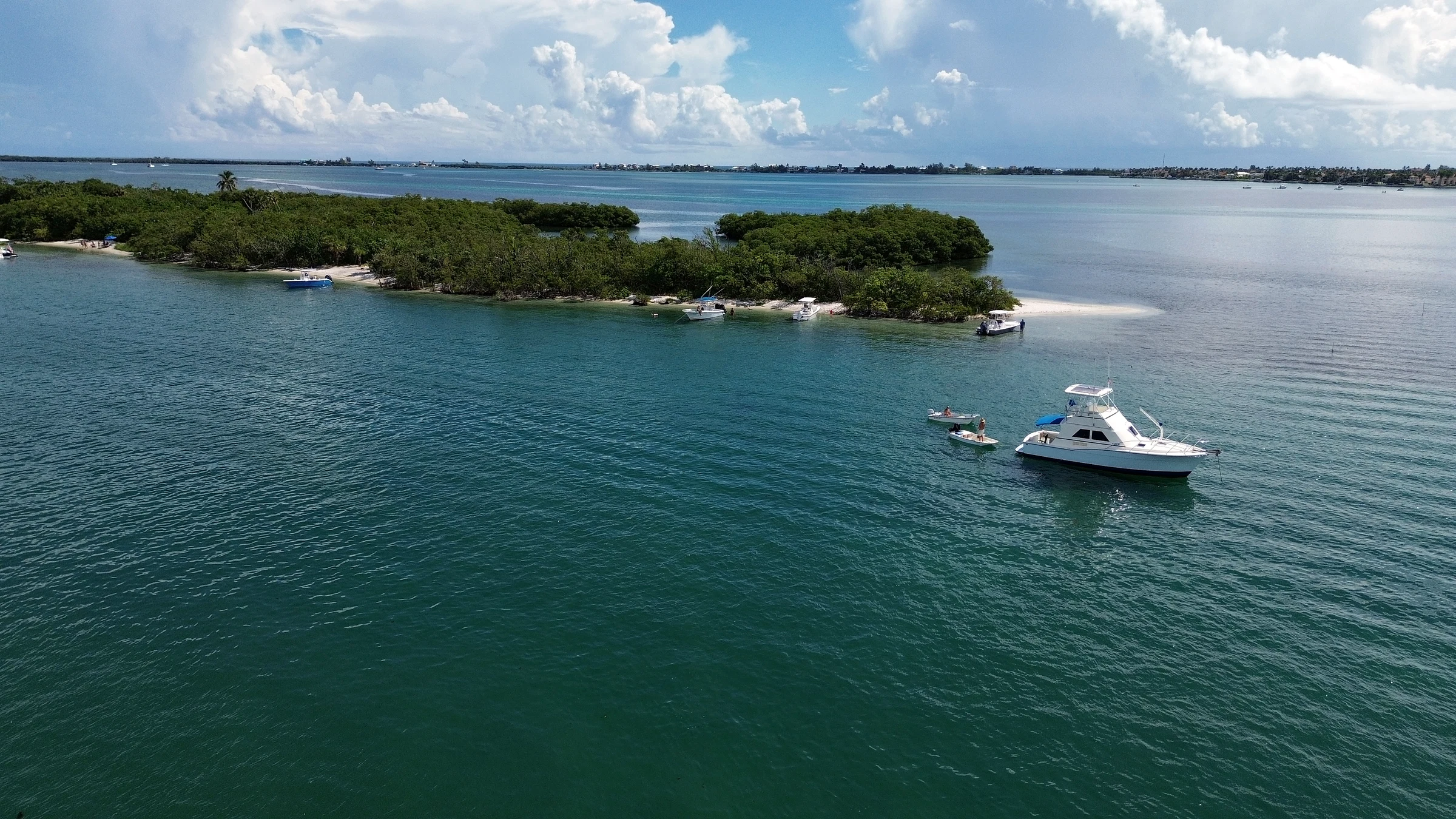 Freebird cruising near a small island and shallow coastal water