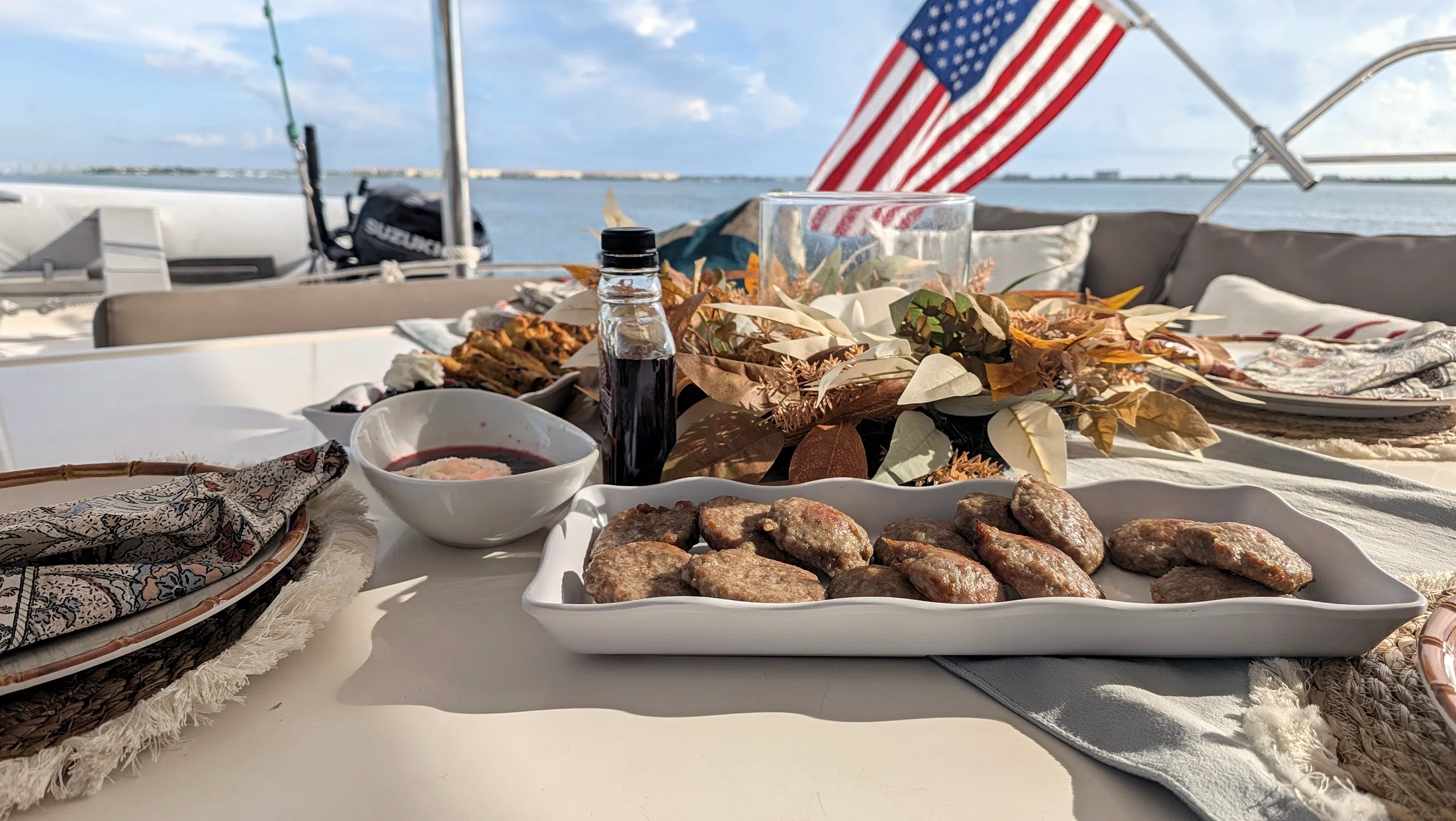 Breakfast served aboard Freebird with water and the American flag beyond