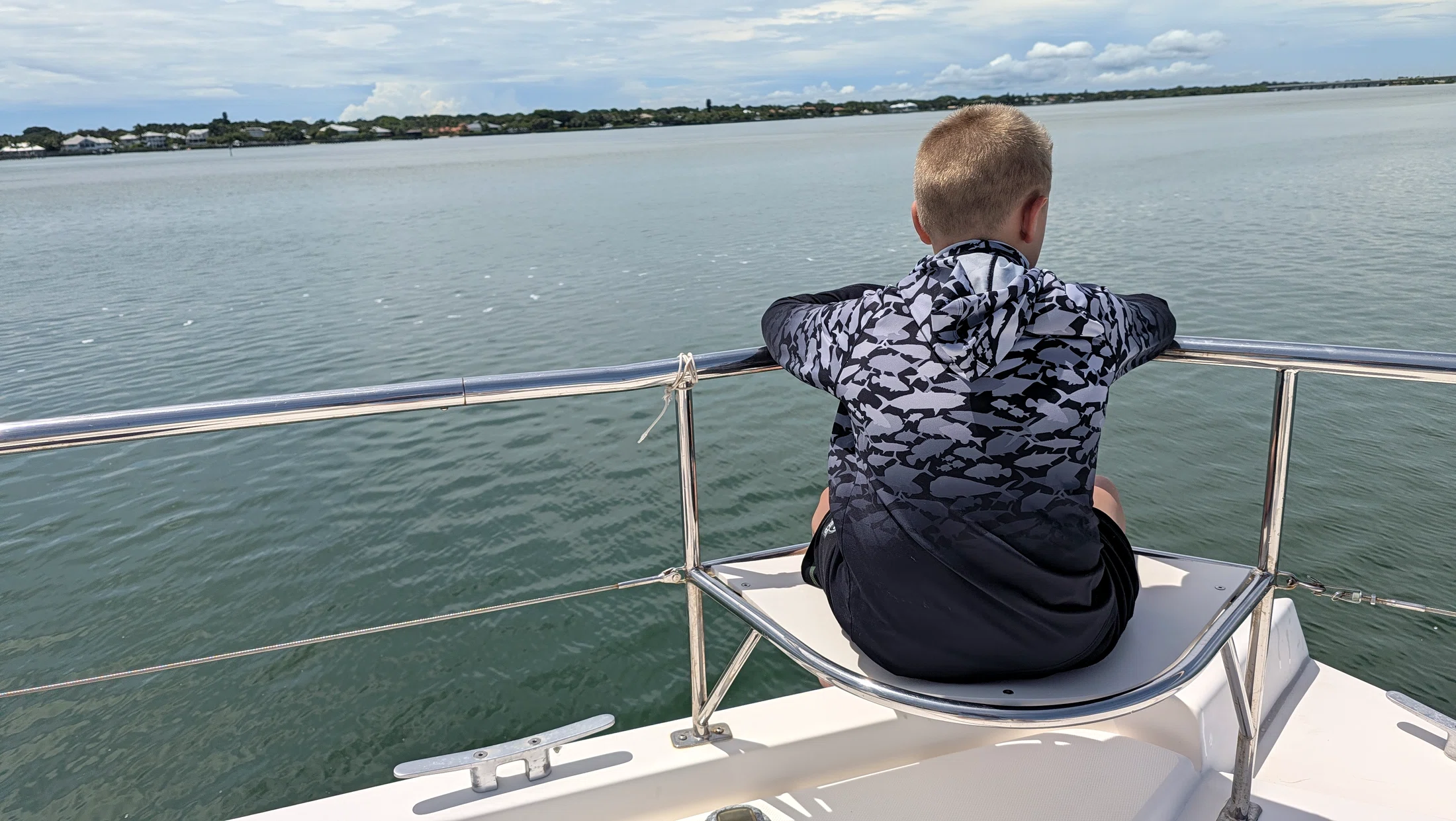 Young guest enjoying the view from the bow of Freebird
